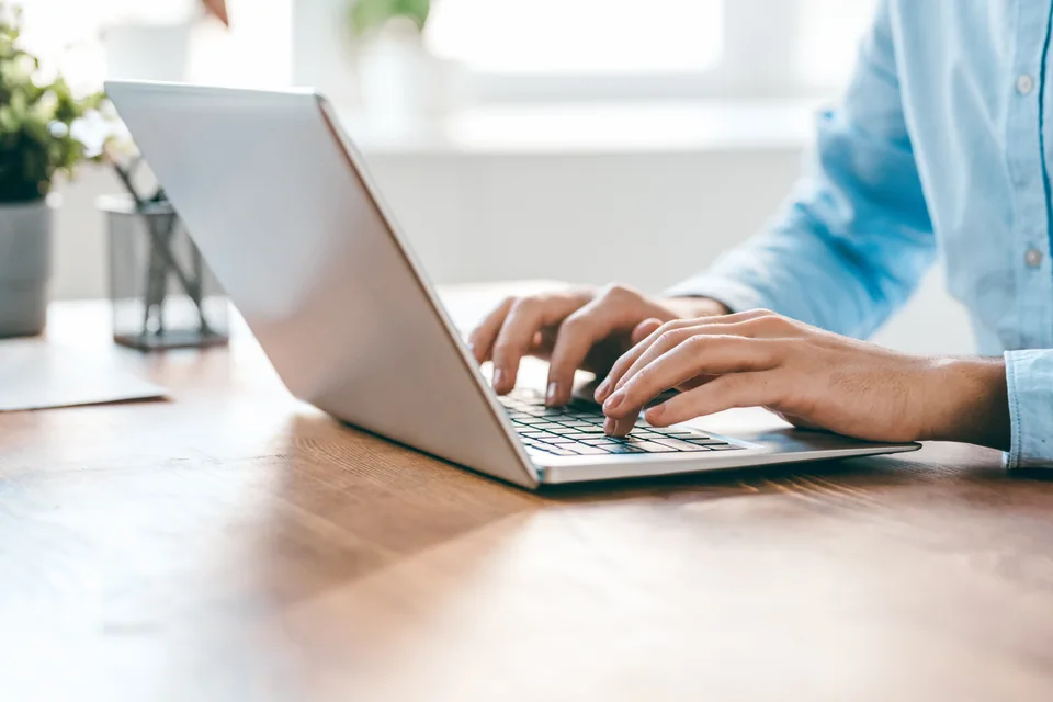 Coworking space Business address: working on a laptop at a desk